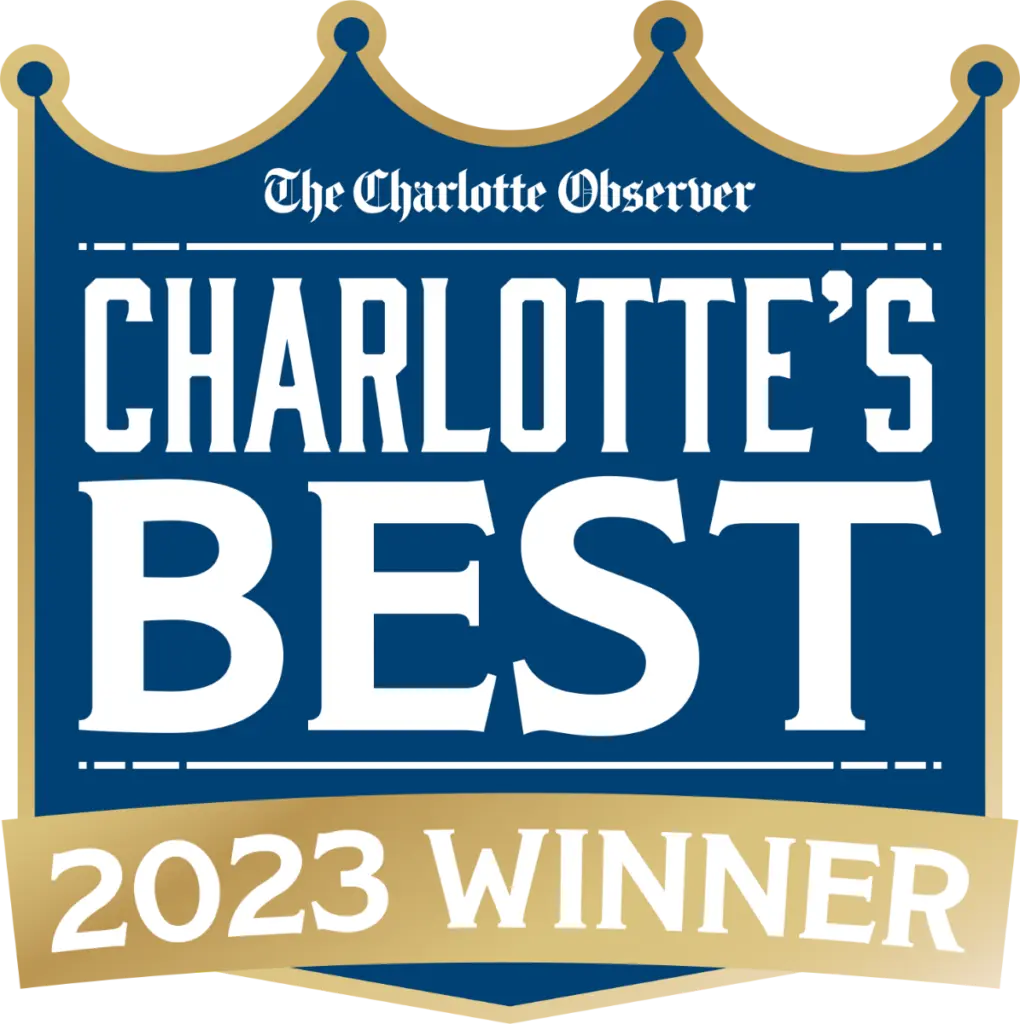 Logo reading "Charlotte's Best 2023 Winner" by The Charlotte Observer with a crown design at the top. Celebrating excellence, Koerich Orthodontics stands proudly among the honorees in Charlotte, NC