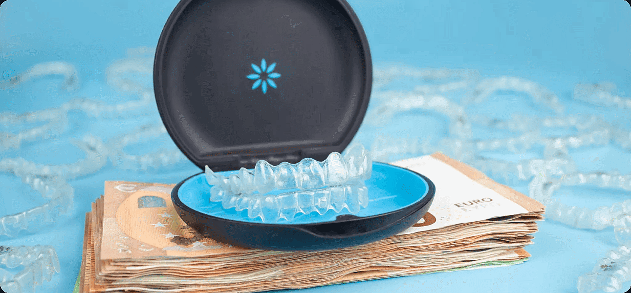 A dental aligner case with clear aligners rests on euro banknotes, alluding to Invisalign cost at Koerich Orthodontics in Charlotte, Indian Trail or Monroe NC, with additional aligners in the background.