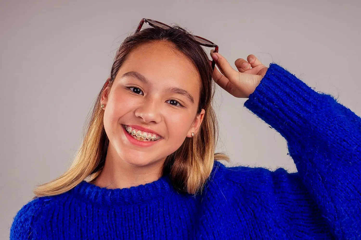Close-up of a woman adjusting to their new braces with affordable braces cost in Charlotte, Indian Trail or Monroe, NC
