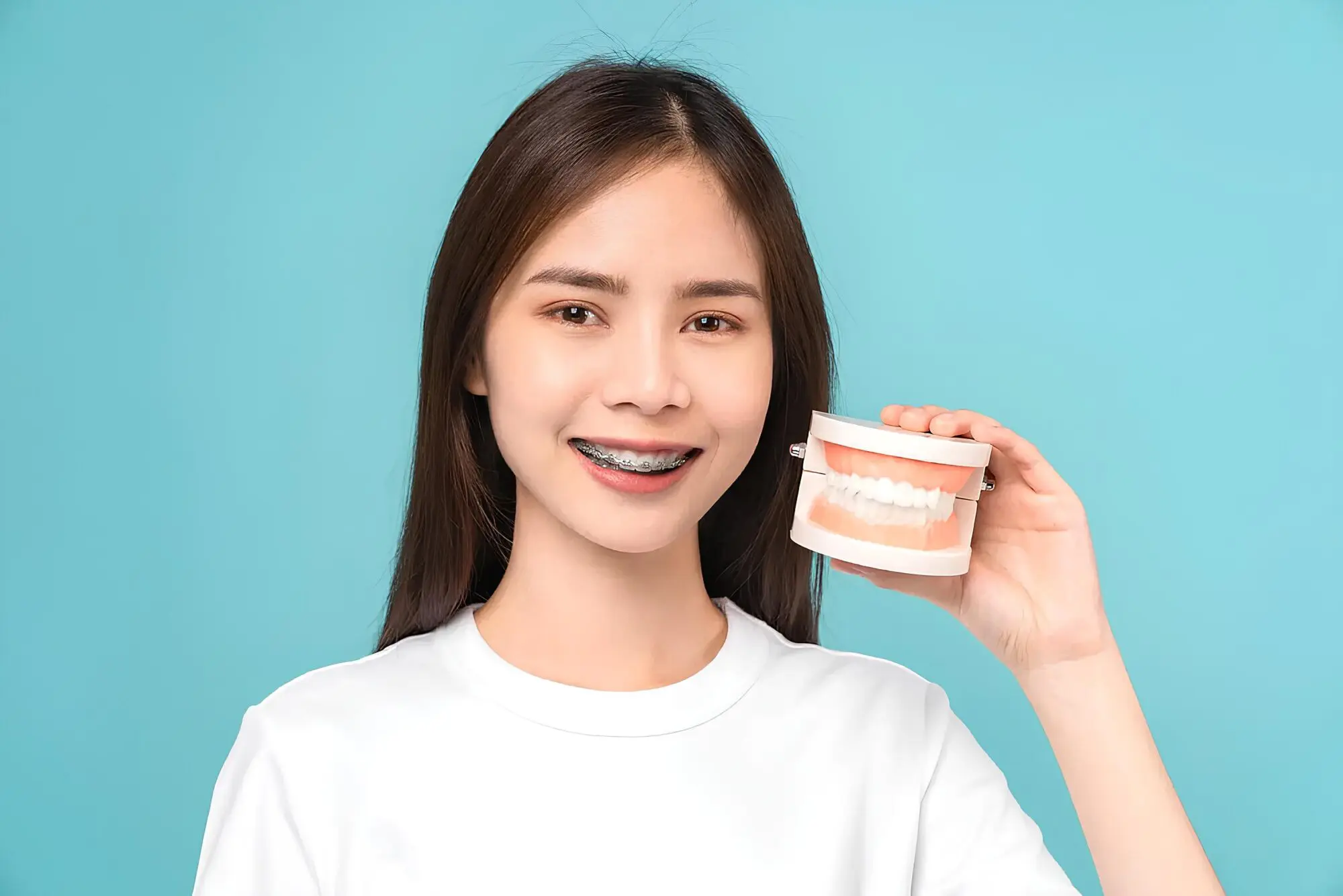 Confident woman smiling with affordable braces cost during an orthodontic treatment journey at Koerich Orthodontics in Charlotte, Indian Trail or Monroe, NC