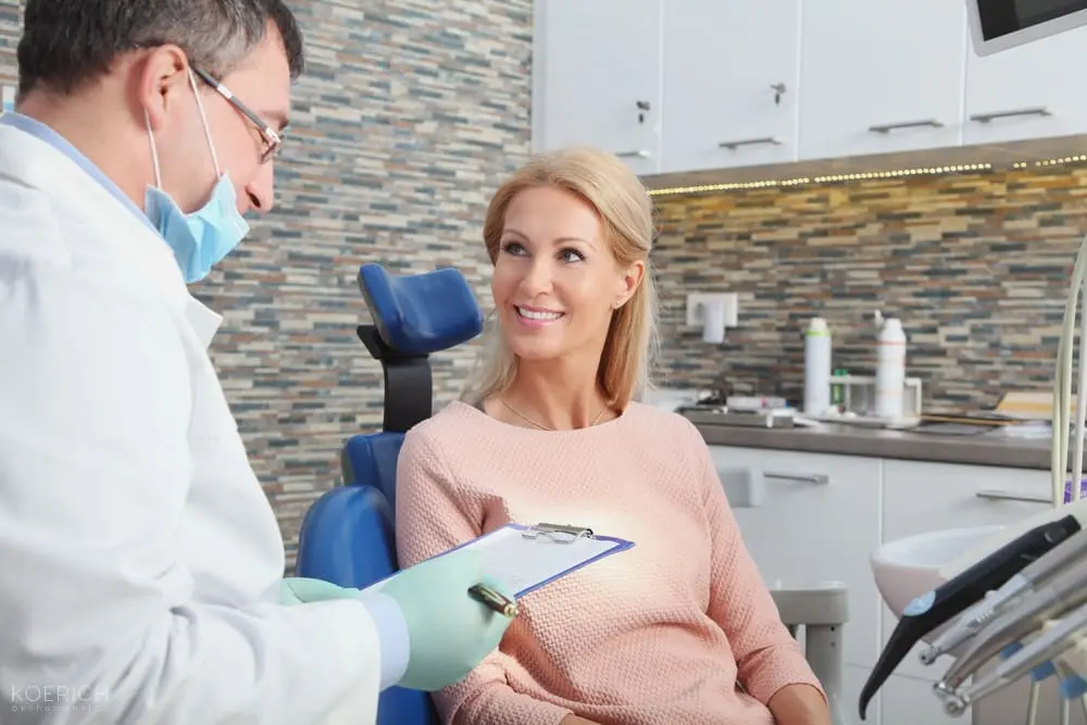 At Koerich Orthodontics in Charlotte, Indian Trail or Monroe, NC, a dentist reviews treatment for mouth breather face with a patient - Mouth Breather Face in Charlotte, NC